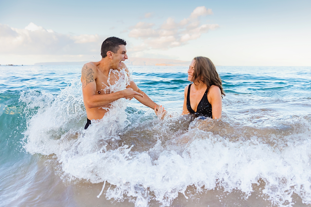 Husband laughing during proposal portrait session in Wailea with Love + Water Photography