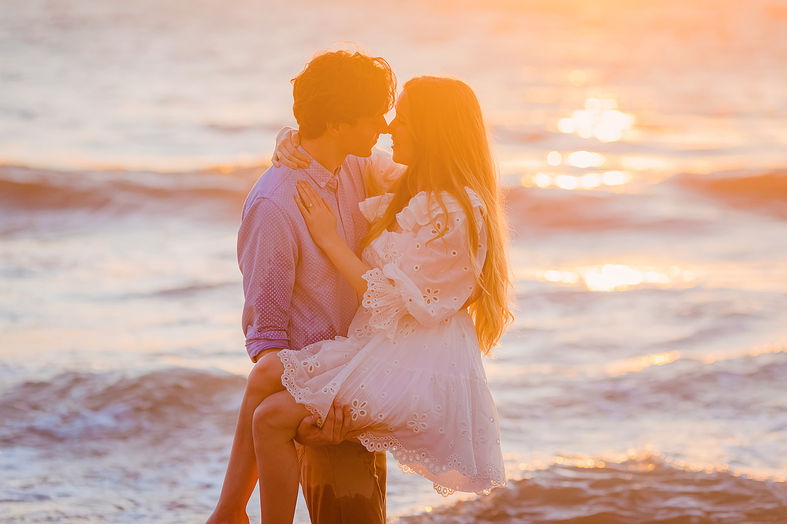 Influencer Mia Maples and her fiance pose for sunset beach engagement photos in Maui with Love + Water Photography.
