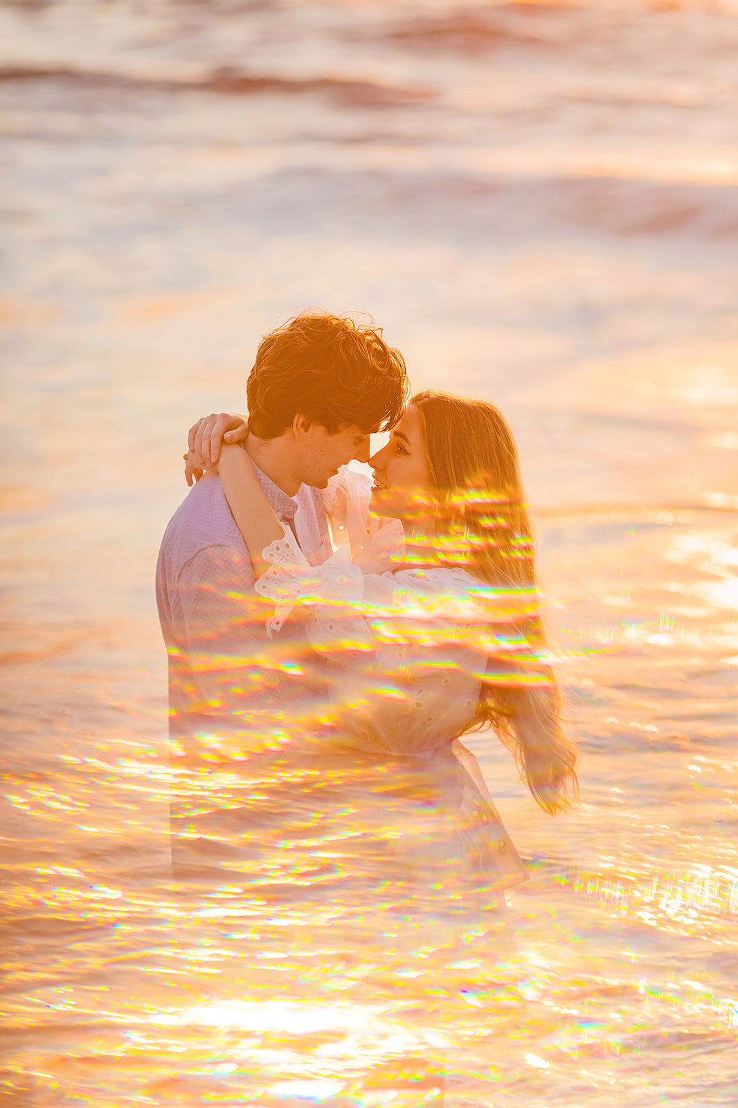A double exposure of Mia Maples and her fiance and the ocean taken by Love + Water Photography for Mia Maples engagement photos. 