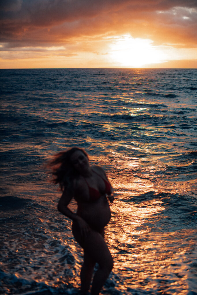 Stunning silhouette capture of a woman during her sunset maternity shoot in Maui