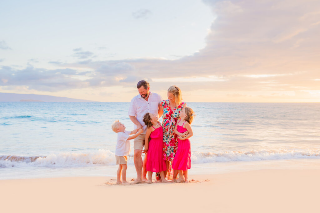 Family of five enjoy the moment during their beach photoshoot