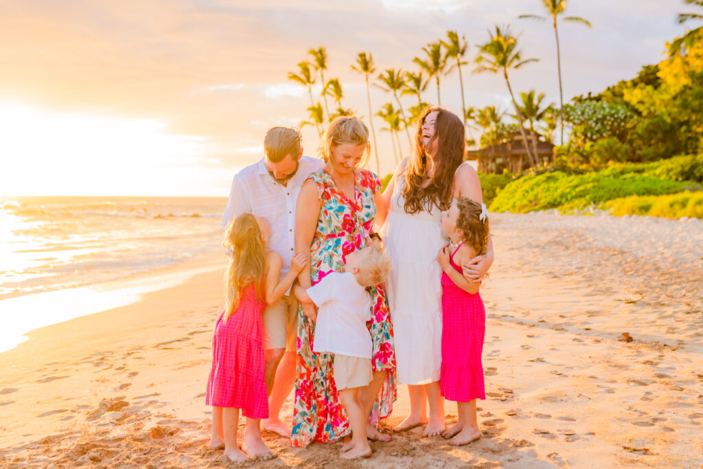 Family soaks up the moment during their beach session on Maui at sunset