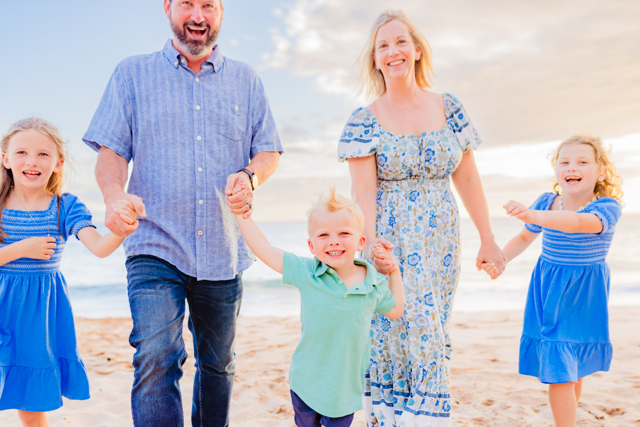 Candid family photo taken on the beach in Wailea