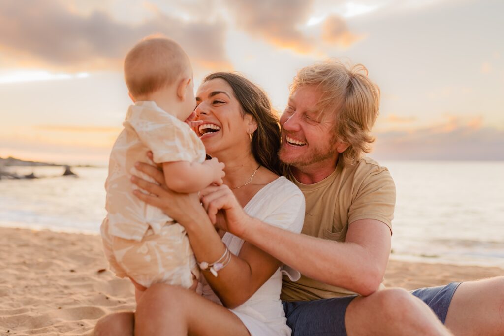 West Maui photoshoot with boy grabbing his mom's nose and dad staring lovingly at his family