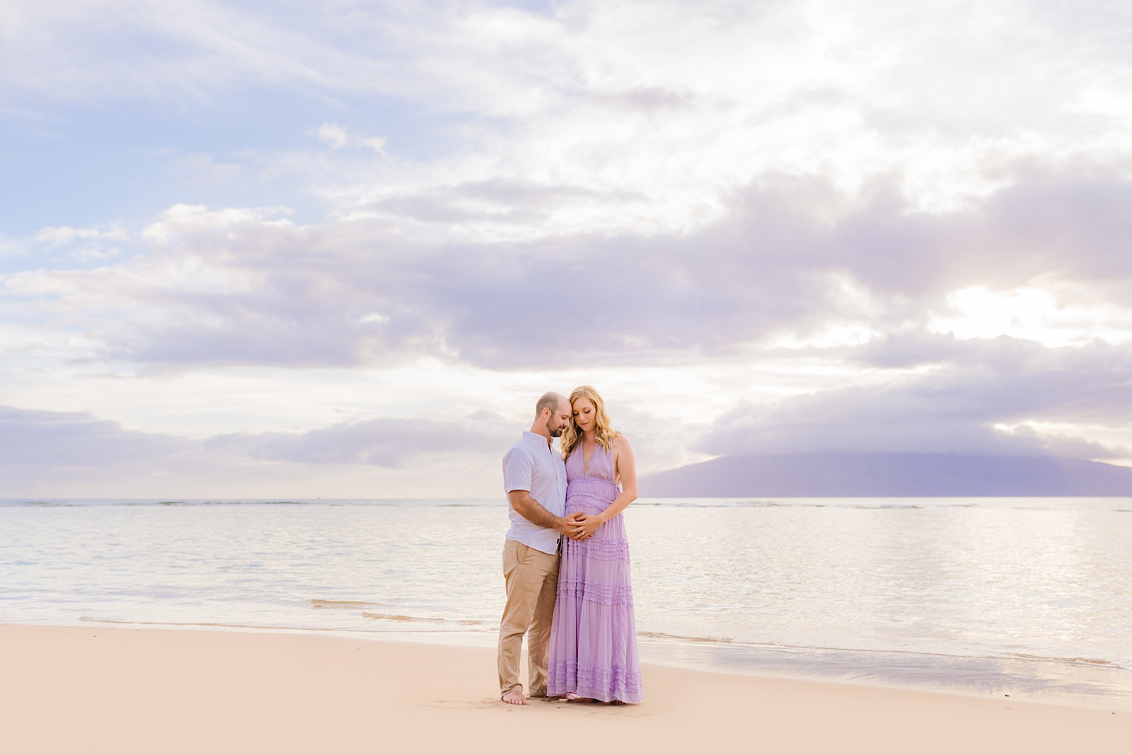 Maui photoshoot at sunrise with purple maternity gown