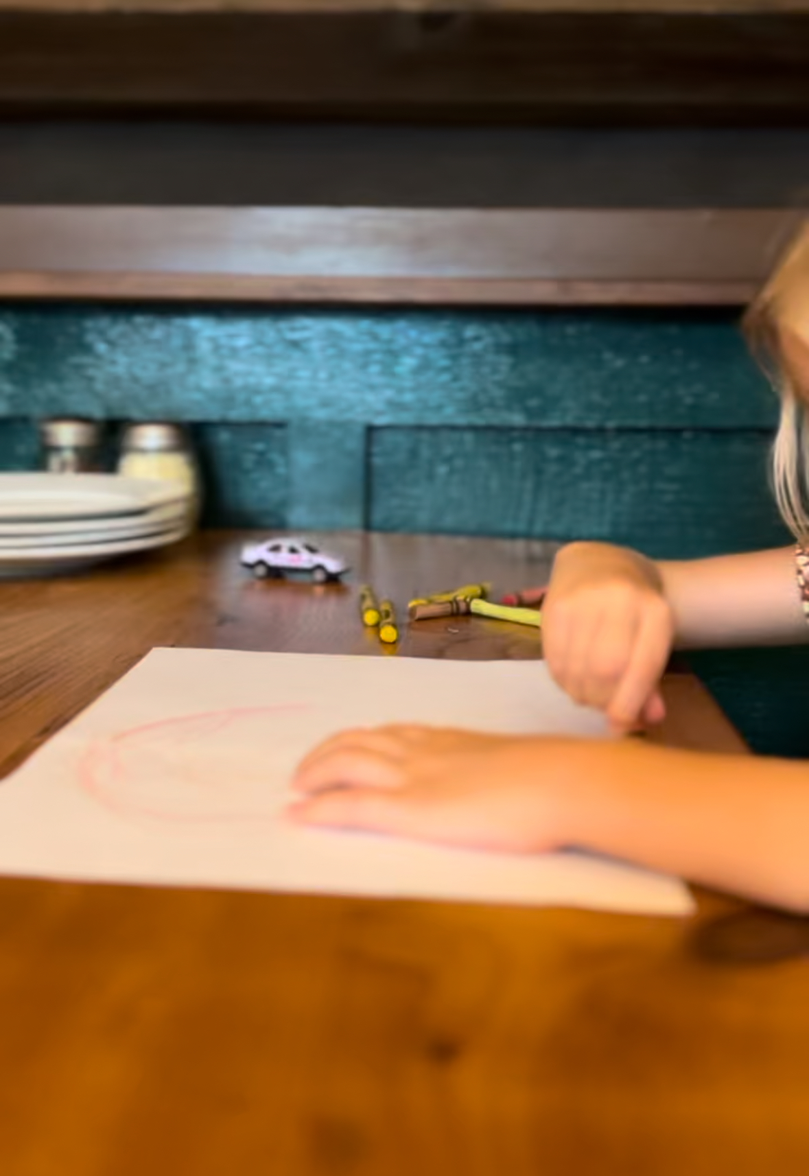 young girl colors her menu at flatbread pizza in paia maui