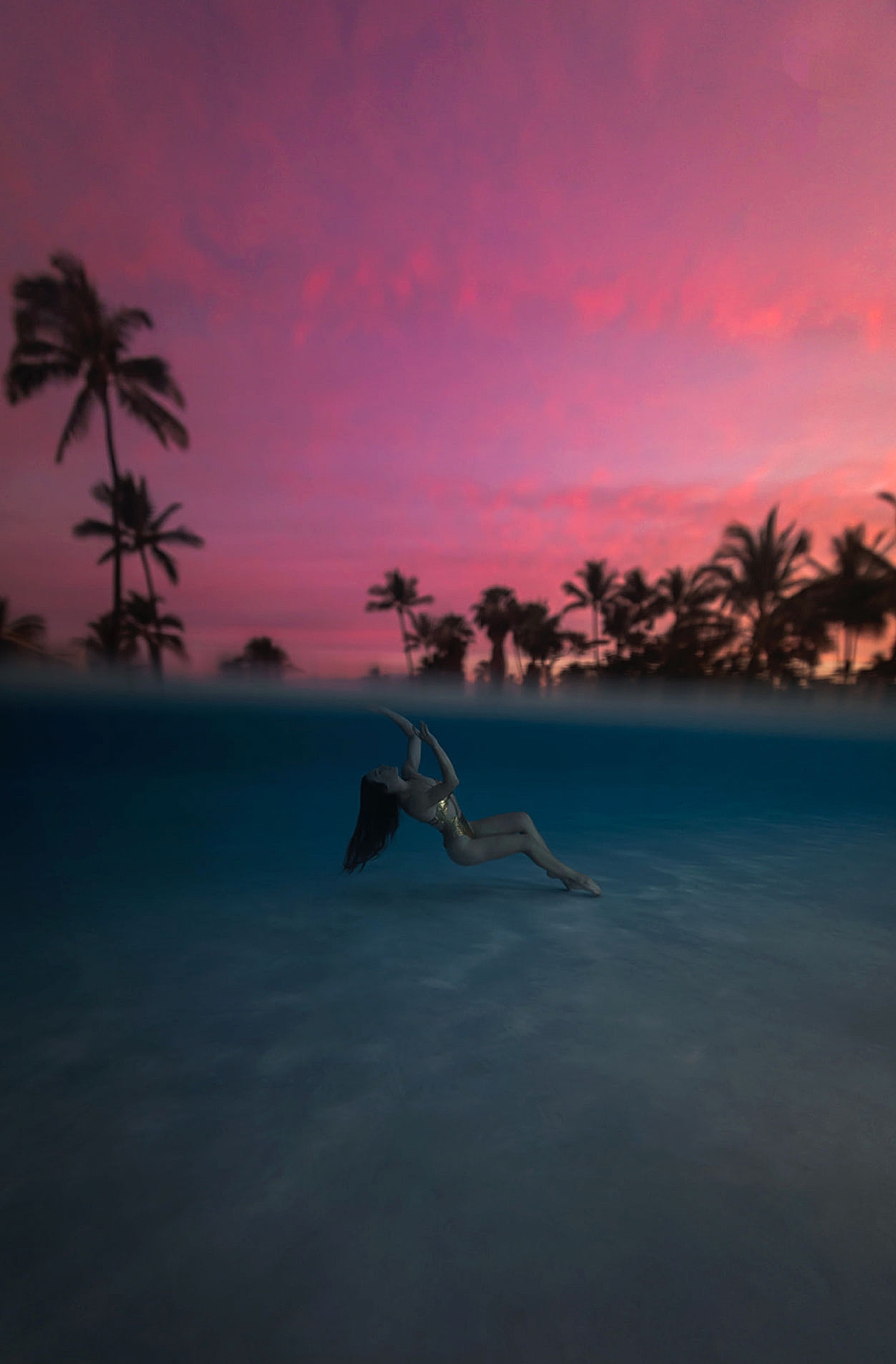 woman poses in the Marriott Wailea Olakino pool on Maui