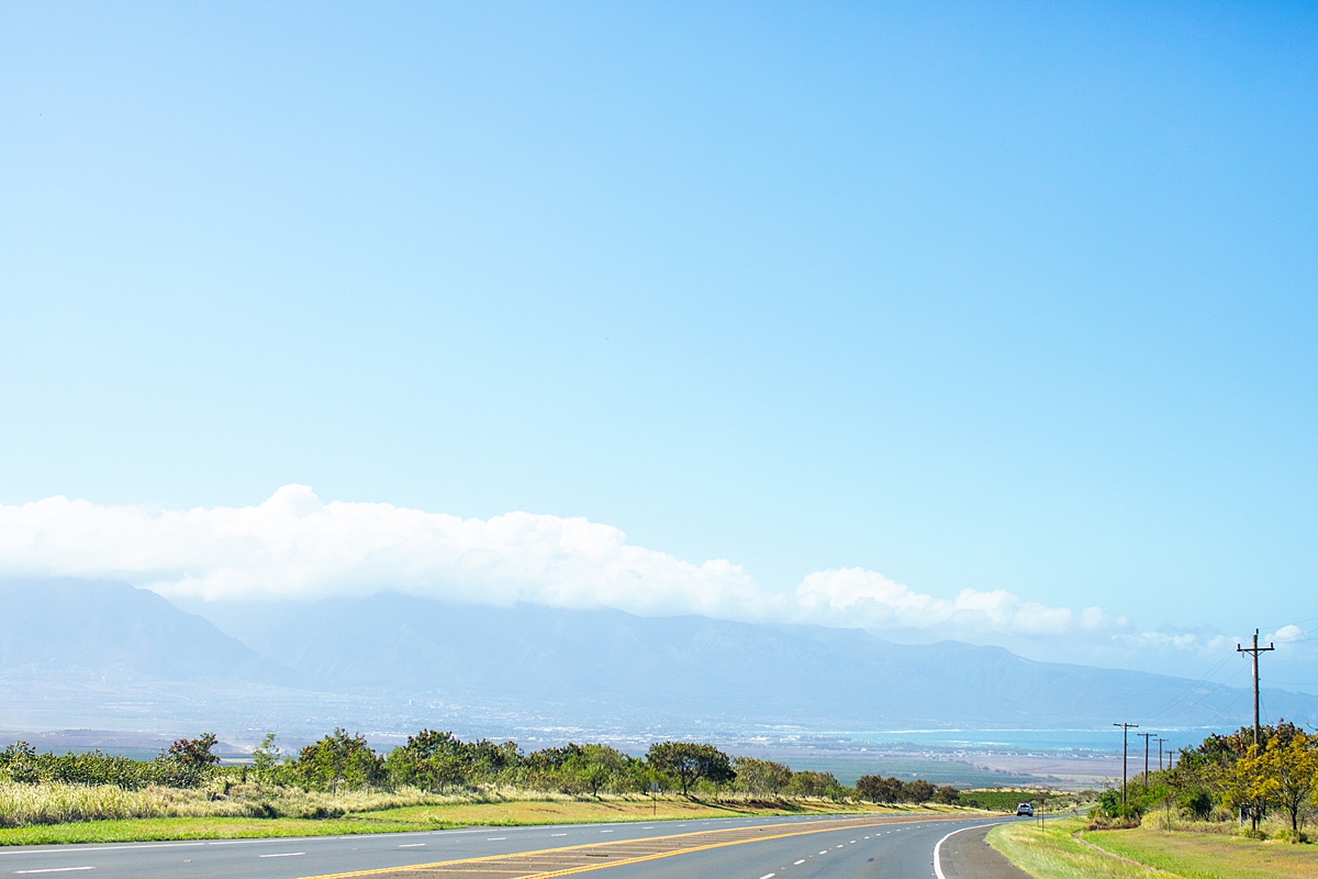 view driving down haleakala highway looking toward central maui and the north shore with west maui mountains in the distance