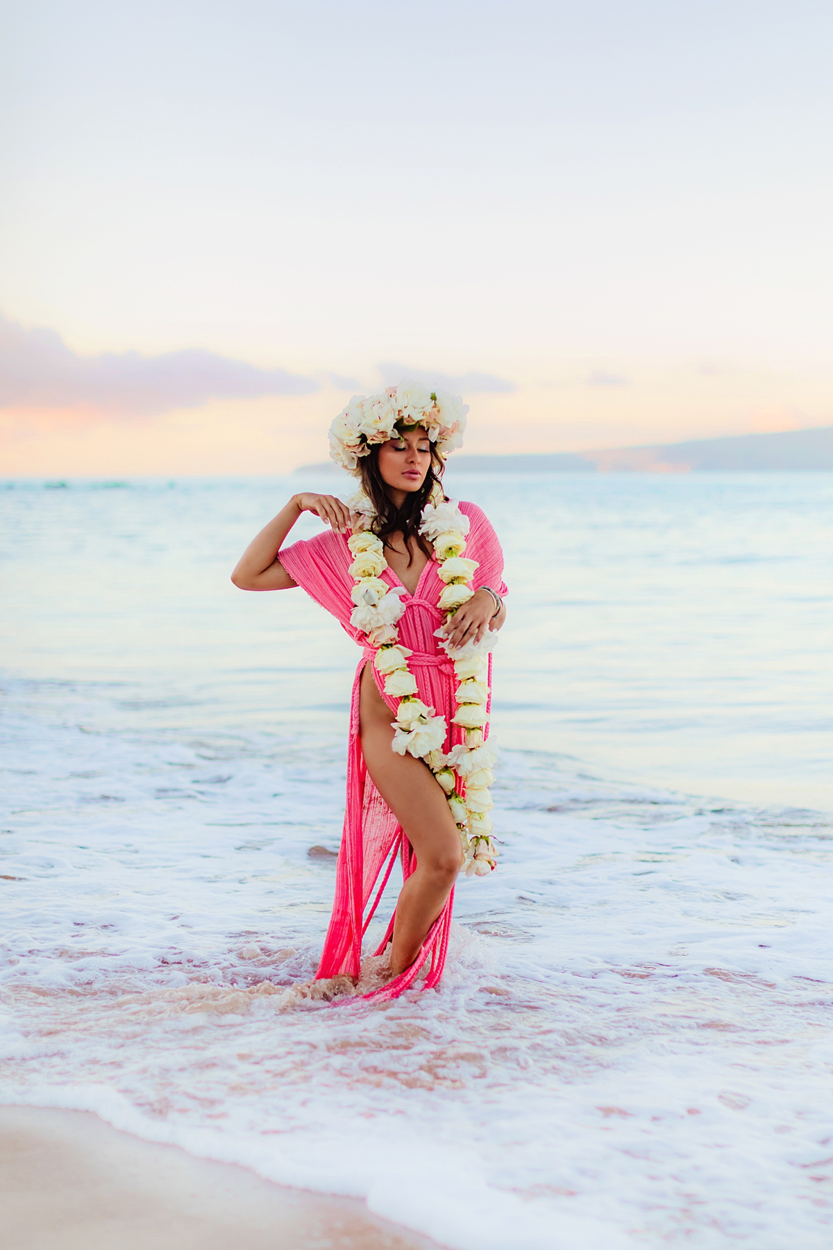 Wailea sunrise portraits featuring pastel gown, delicate florals and a mermaid palette