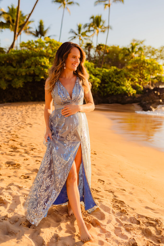 Woman in her second trimester of pregnancy wearing a series of maternity Dresses for a Beach Photoshoot on Maui
