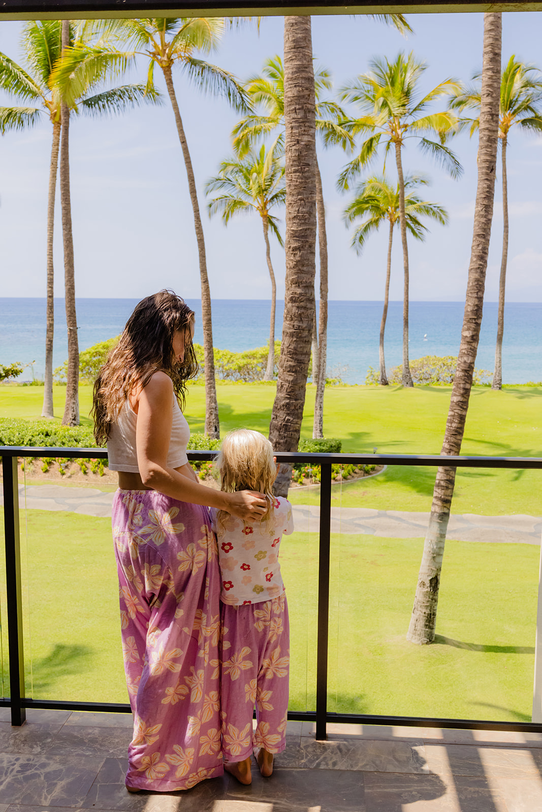 mother and daughter posing on a lanai at Andaz Maui wearing Dolkii pant luca
